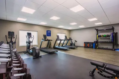 a gym with several treadmills and exercise bikes at Hampton Inn By Hilton Ocoee Orlando in Orlando