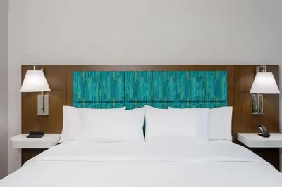a bedroom with a large white bed with two lamps at Hampton Inn By Hilton Ocoee Orlando in Orlando