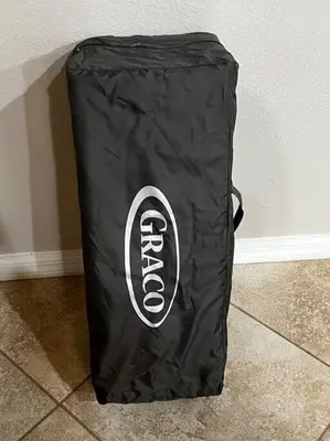 a black bag sitting on the floor next to a wall at Cozy Getaway in Orlando