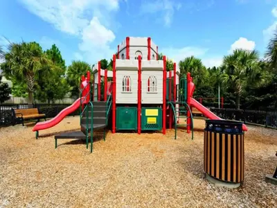 a playground with a slide in a park at Luxury Disney Villa 5BR With Private Pool and Spa (4 Miles from Disney) in Orlando