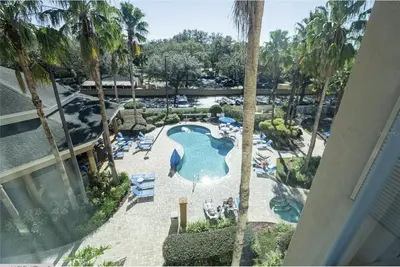 an overhead view of a swimming pool at a resort at 3 beds DisneyFree Shuttle in Orlando