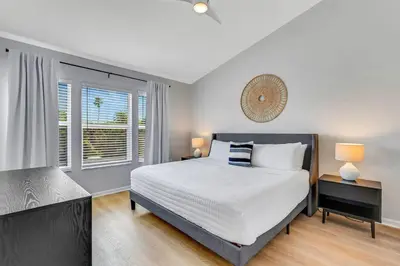 a bedroom with a large bed and a window at Windsor Hills Townhouse in Orlando