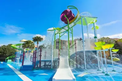a water park with a water slide in a pool at Windsor Hills Townhouse in Orlando