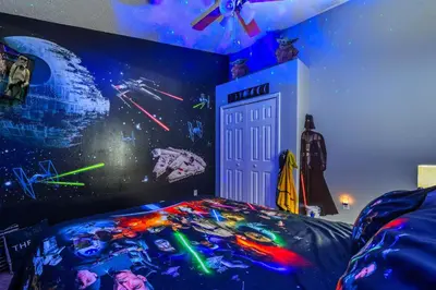 a bedroom with a bed with a star wars mural at Wheelchair accessible Lakeview 4BR house with pool spa themed rooms game room in Kissimmee