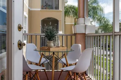 a patio with a table and chairs on a balcony at Star Wars Themed Home at Windsor Palms in Kissimmee