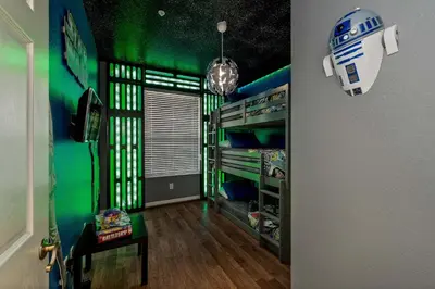 a room with a star wars room with green walls at Star Wars Themed Home at Windsor Palms in Kissimmee