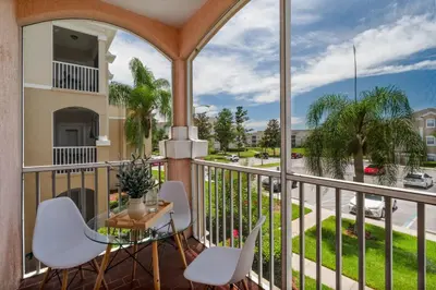 a balcony with a table and chairs and a view of a street at Star Wars Themed Home at Windsor Palms in Kissimmee