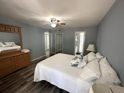 a bedroom with a bed and a ceiling fan at Disney's Townhome in Kissimmee