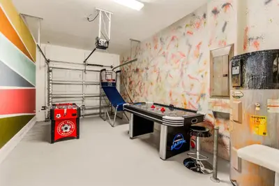 a room with a ping pong table in a room at Dream Getaway Modern 6-Bedroom Vacation Home in Kissimmee