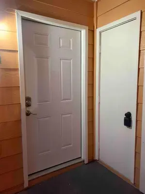 an empty room with a white door and a wall at Disney enchantment getaway in Kissimmee