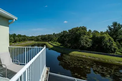 a balcony with a view of a river at Disney Retreat Lakeview townhome - close to golf in Orlando