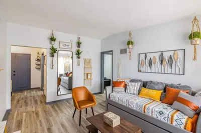 a living room with a couch and a table at Magical 3BR Orlando Getaway Kitchen Near Parks in Orlando