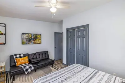 a bedroom with a bed and a couch at Magical 3BR Orlando Getaway Kitchen Near Parks in Orlando