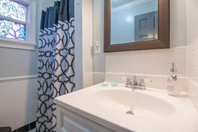 a bathroom with a sink and a shower curtain at Orlando 3BR2BA Family Stay with Big Savings in Orlando
