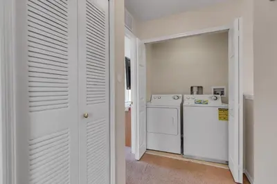 a white laundry room with a washer and dryer at RO2707BD - 4Bedrms - Regal Oaks in Orlando