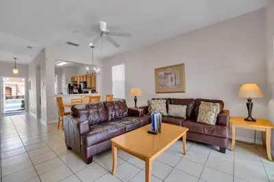 a living room with a couch and a table at RO2707BD - 4Bedrms - Regal Oaks in Orlando