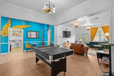 a living room with a ping pong table at Banana Leaf Villa-Island groove-Standard room in Orlando