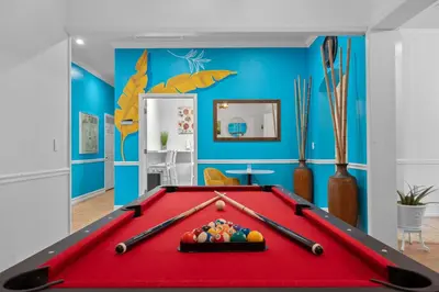 a red pool table in a room with blue walls at Banana Leaf Villa-Island groove-Standard room in Orlando