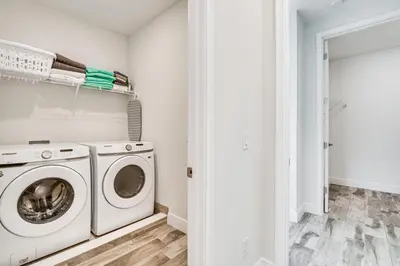 a laundry room with a washer and dryer at about 11 Mi to Disney Bright Kissimmee Townhome! in Orlando