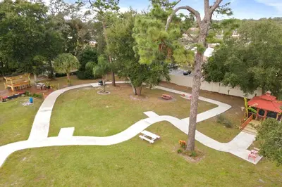 an aerial view of a park with a tree at Banana Leaf Villa-Marley Junior Suite with Living Room in Orlando