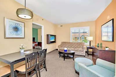 a living room with a couch and a table at Near Disney 1BR Condo unit - Pool HT in Orlando