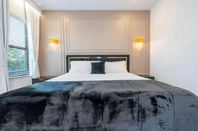 a bedroom with a large bed in a room at Amazing New 15-bed home up to 30 people in Orlando