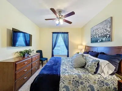a bedroom with a bed and a ceiling fan at Summer Dreams 3 Bed Condo in Windsor Hills condo in Orlando
