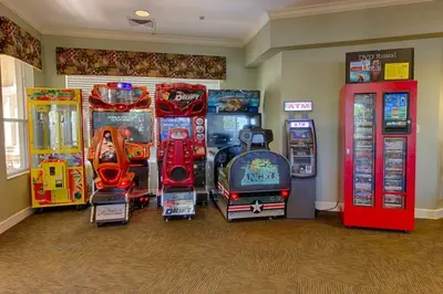 a room with arcade games and video game machines at Summer Dreams 3 Bed Condo in Windsor Hills condo in Orlando