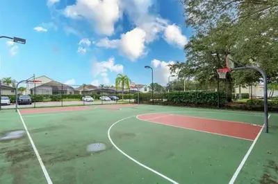 a basketball court with a basketball hoop at 8102-IBRAHIM · 8102 Vacation getaway at Windsor in Kissimmee