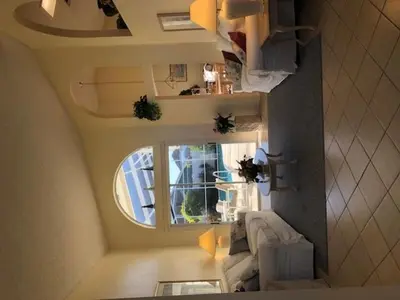 a small room with a couch and a window at Family Fun Vacation Home villa in Kissimmee