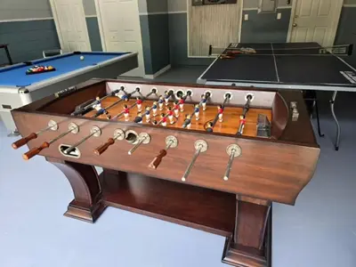 a wooden foosball table with at Lake House near Disney in Kissimmee