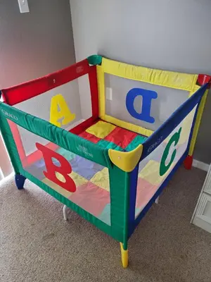 a colorful toddler bed with letters and numbers at Lake House near Disney in Kissimmee