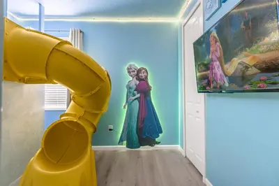 a room with a large yellow lego house at Upstay-Mansion w Spa-Pool-Cinema-Games - Sleeps 36 in Kissimmee