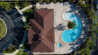 an overhead view of a building with a swimming pool at Family Spacious 3BR Townhouse with BBQ n' Pool Access in Kissimmee