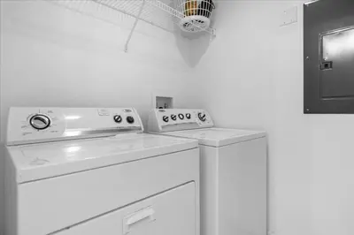 a white washer and dryer in a room at 3 Bed 2,5 Bath Perfect Family home Bunk Beds townhouse in Kissimmee