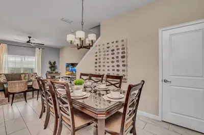 a dining room with a table and chairs at 3097Pequod townhouse in Kissimmee