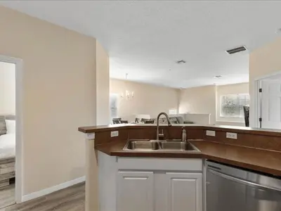 a kitchen with a sink and a counter top at Oakwater Retreat condo in Orlando