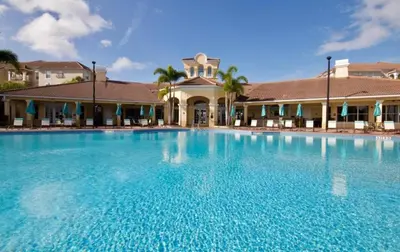 a large swimming pool in front of a building at Your Vista Cay Lakeview Allure condo in Orlando