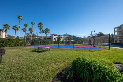 a park with a playground with a trampoline at Your Vista Cay Lakeview Allure condo in Orlando