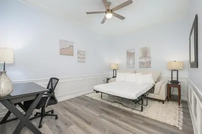 a white room with a bed and a desk at Stunning Vacation Condo - Vista Cay Resort - 2016 in Orlando