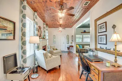 a living room with a ceiling fan and a living room at Walk to Historic Dtwn Sanford Home with Gas Grill! in Sanford