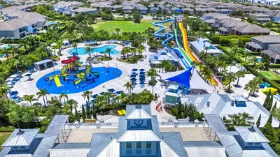 an aerial view of the splash park at the resort at Lovely Home With Theme Rooms, Game Room With Waterpark & Resort Access Resort Access At Encore Resort- 7705By in Kissimmee