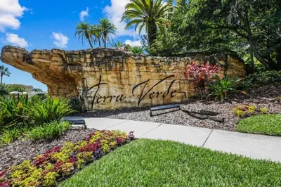 a rock wall with the words karma yourself written on it at 201 HB - Hideaway at TerraVerde in Kissimmee