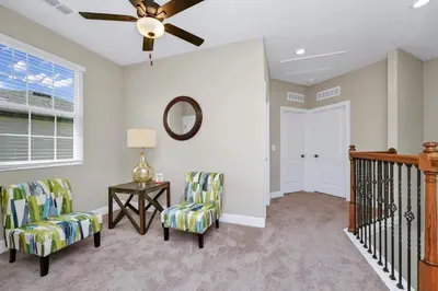 a living room with two chairs and a ceiling fan at Inviting Home Near Disney With Waterpark & Resort Access At Encore Resort - 7792Sw in Kissimmee