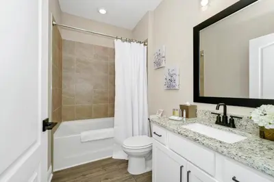a bathroom with a toilet and a sink and a tub at Inviting Home Near Disney With Waterpark & Resort Access At Encore Resort - 7792Sw in Kissimmee