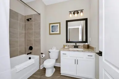 a bathroom with a toilet and a sink and a bath tub at Inviting Home Near Disney With Waterpark & Resort Access At Encore Resort - 7792Sw in Kissimmee