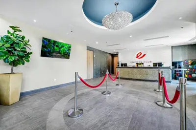 a lobby with red ribbon barriers and a potted plant at Inviting Home Near Disney With Waterpark & Resort Access At Encore Resort - 7792Sw in Kissimmee
