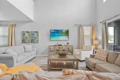 a living room with two couches and a coffee table at 5 Bedroom 5 Bathroom Storey Lake 4760KC in Kissimmee