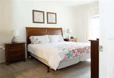 a bedroom with a bed with two night stands and two lamps at 3 Bedroom 2 Bathroom Lucaya Village 15-103 in Kissimmee