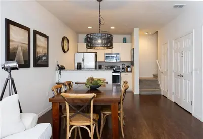 a kitchen and dining room with a table and chairs at 3 Bedroom 2 Bathroom Lucaya Village 15-103 in Kissimmee